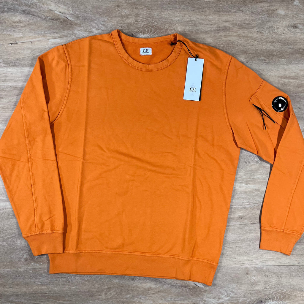 CP Company Light Fleece Crewneck Lens Sweatshirt in Russet Orange